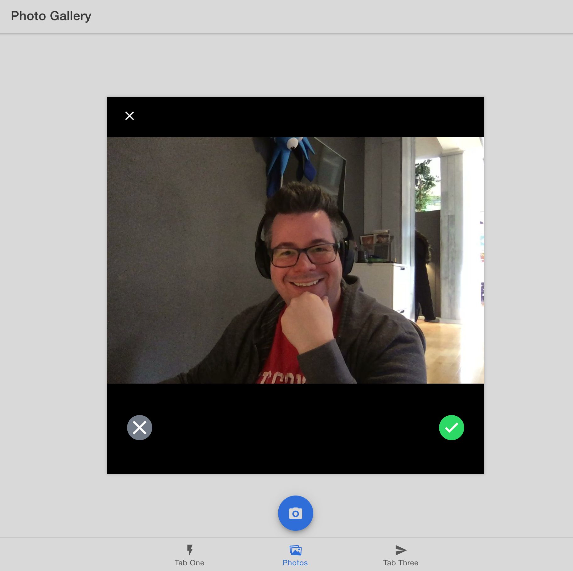 A photo gallery app displaying a webcam selfie.