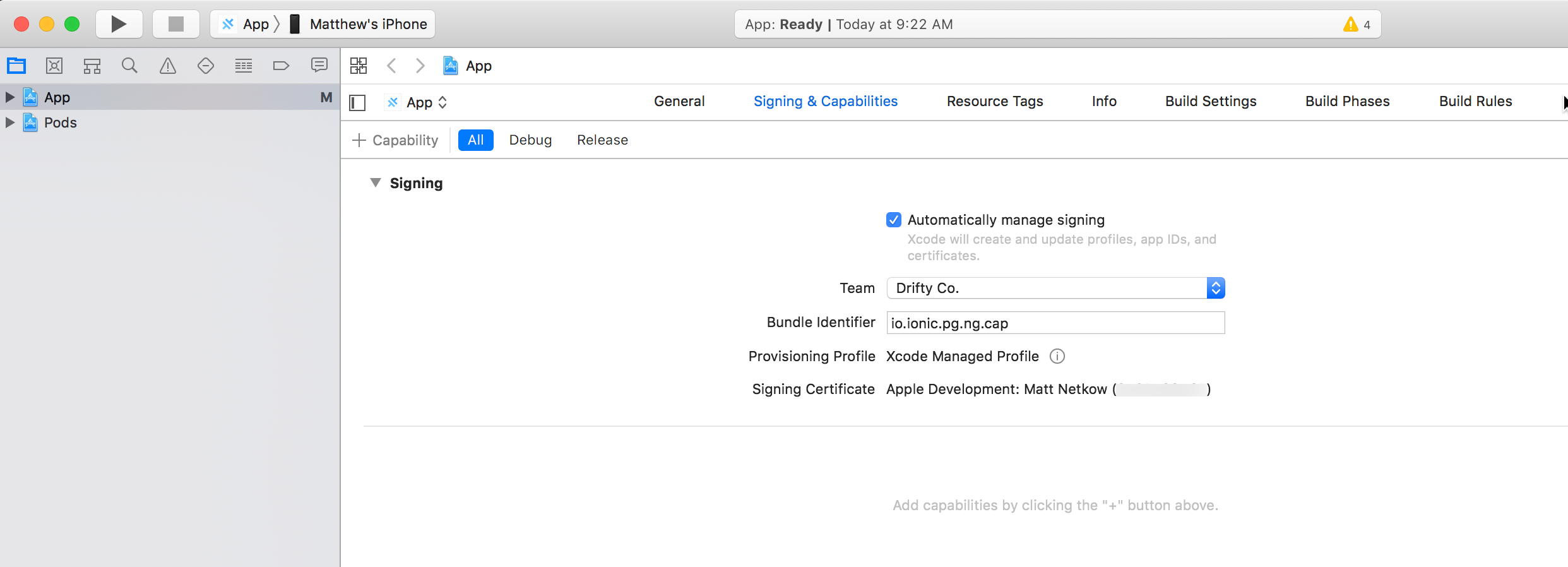 The Xcode interface displaying the Signing and Capabilities tab for an iOS app project.